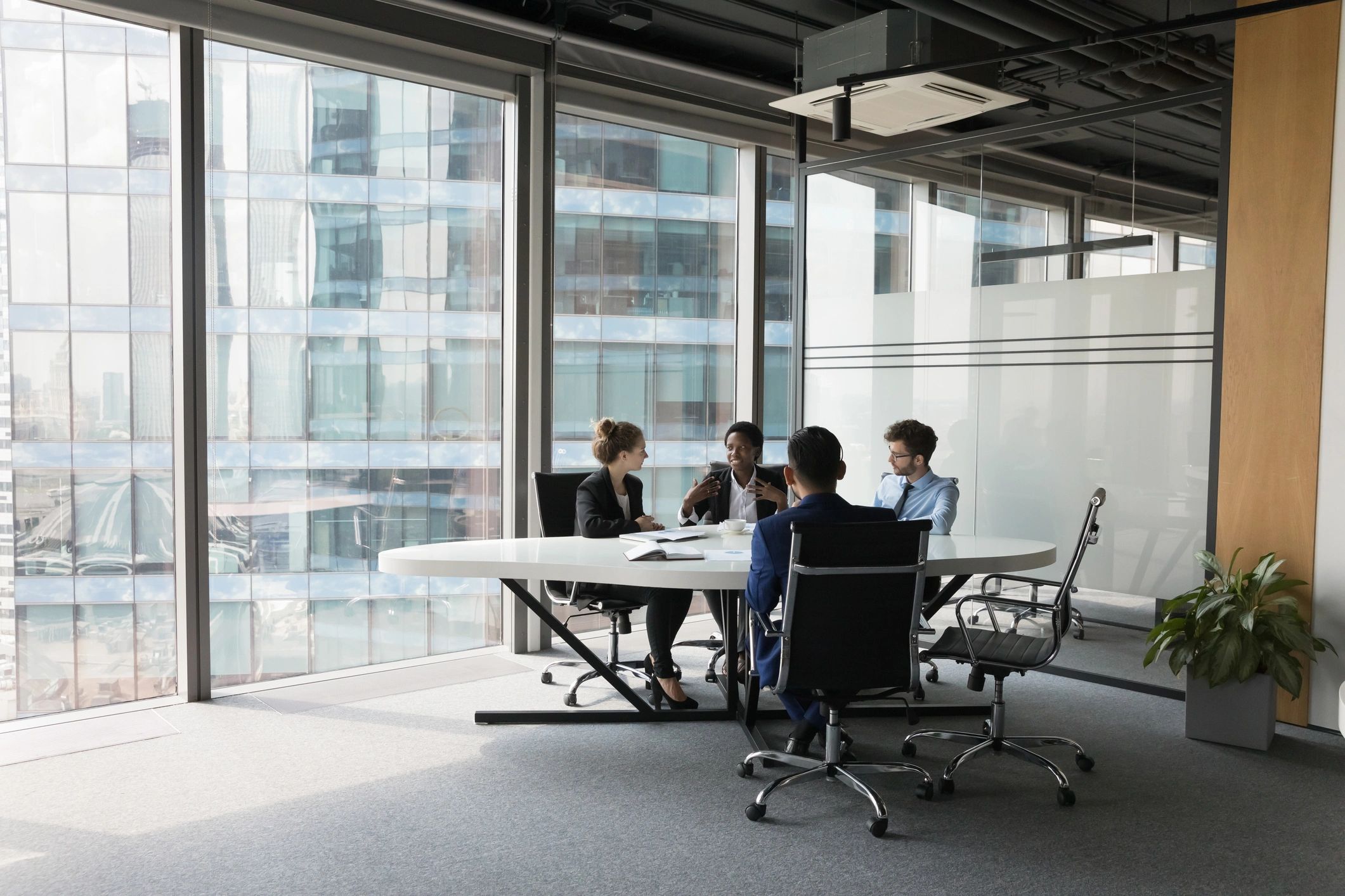 Executive team discussing a project in a meeting room