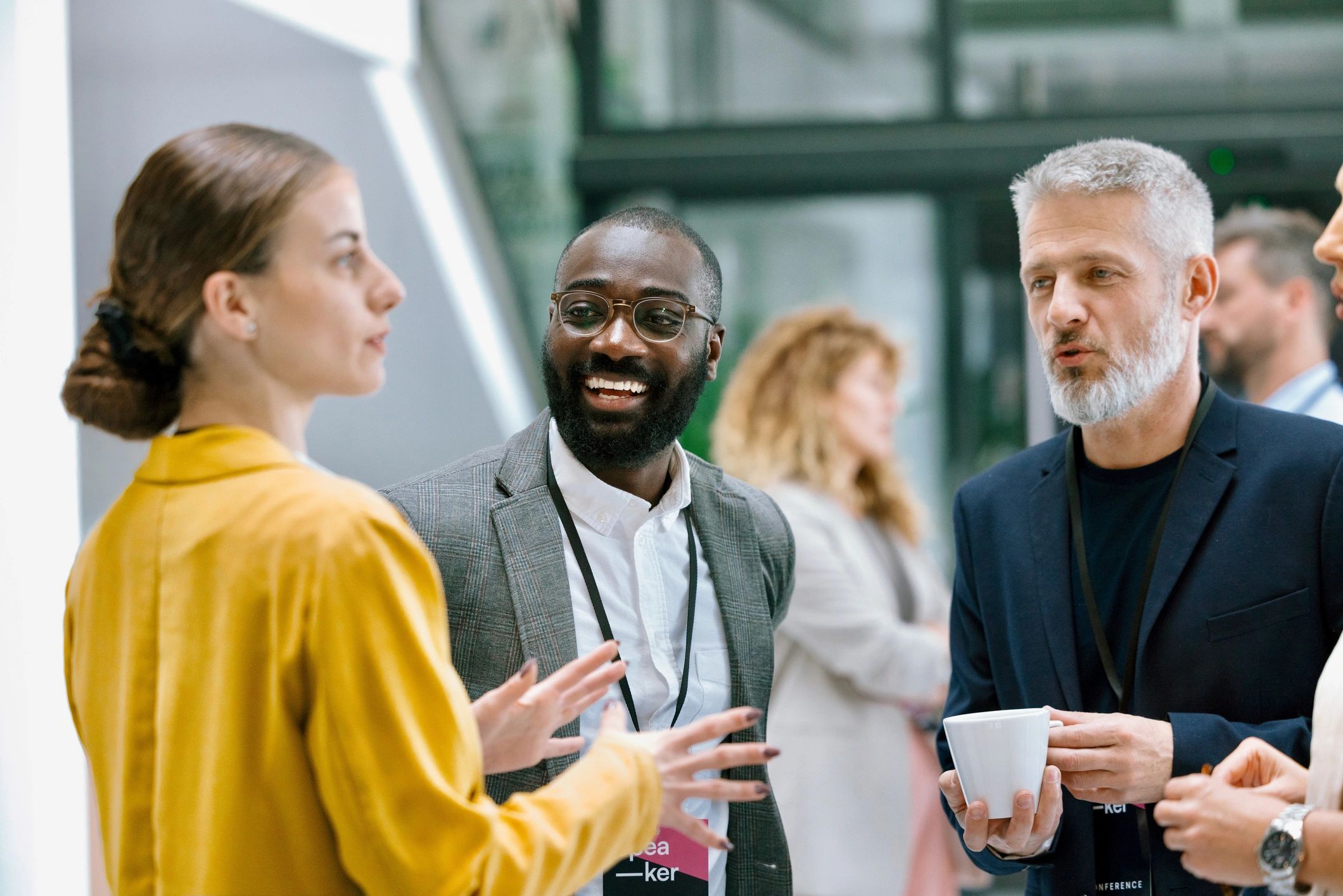 Colleagues discussing strategy during a conference break